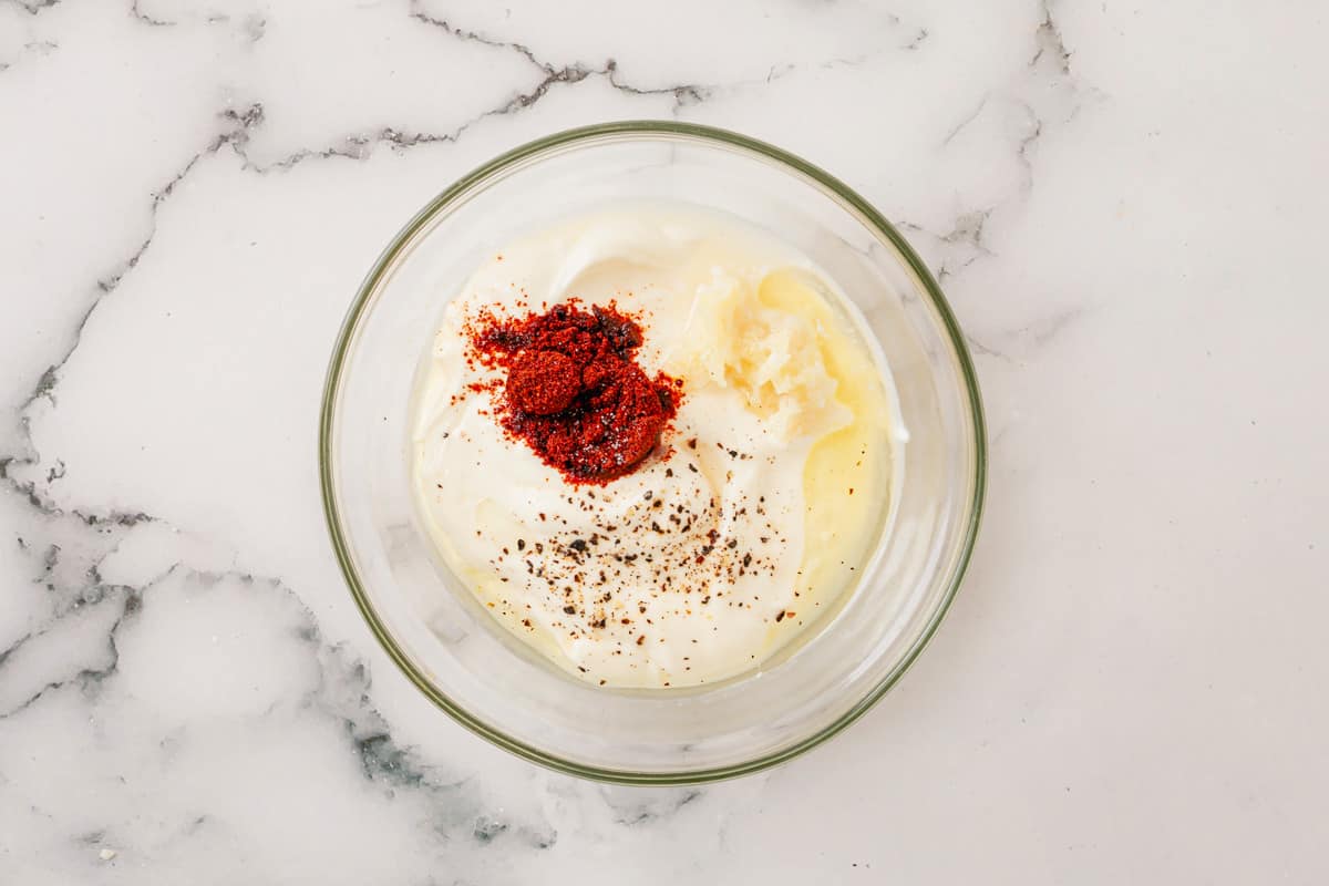 ingredients for chipotle aioli in a transparent bowl