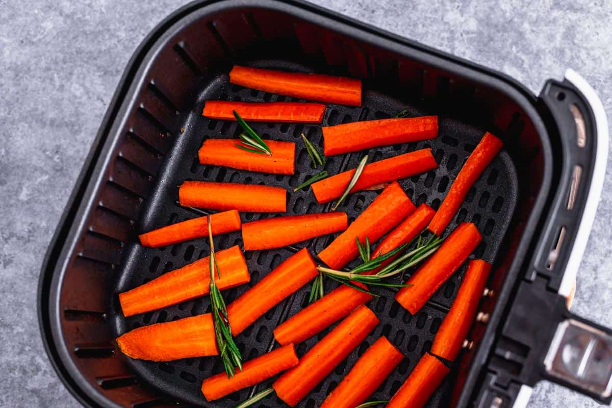 honey glazed carrots in air fryer basket before frying