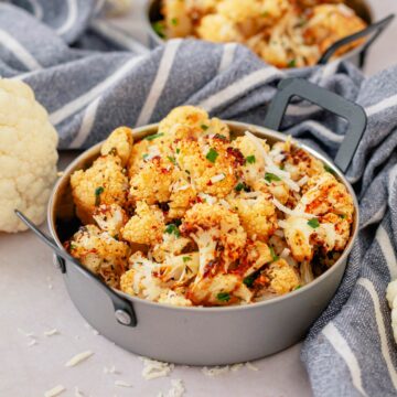 air fryer cauliflower in small metal serving dish