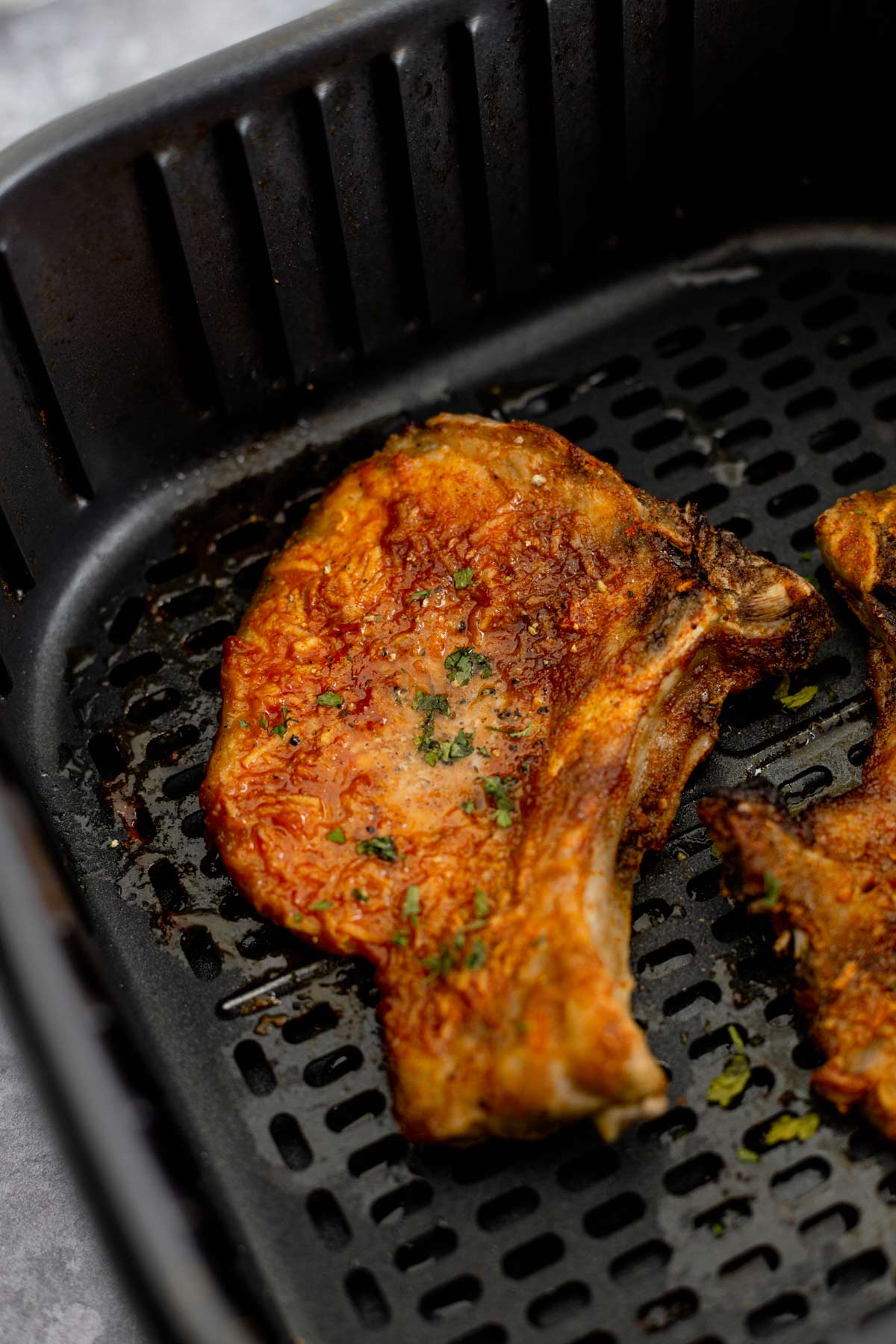 cooked bone in pork chops in air fryer basket