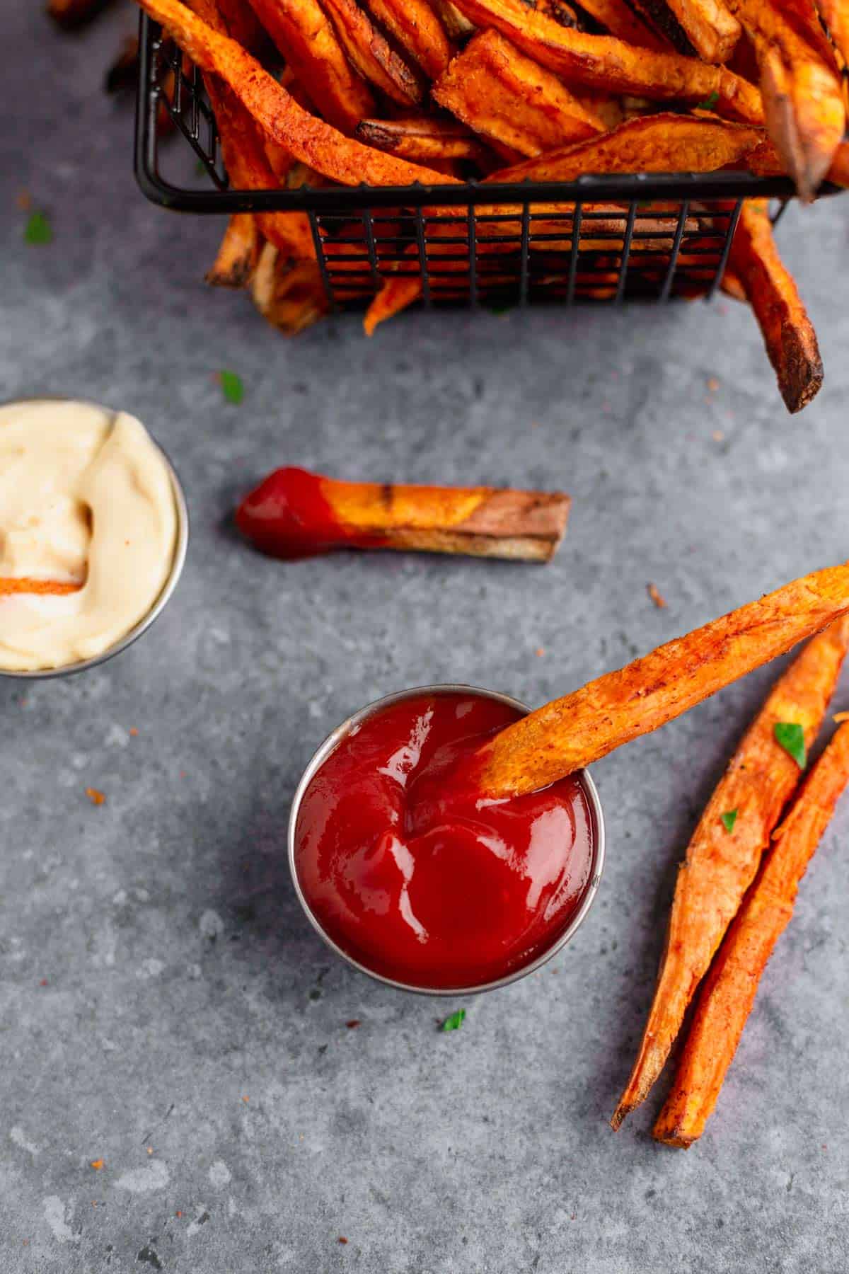 Air Fryer Sweet Potato Fries with parsley and mayonnaise and ketchup