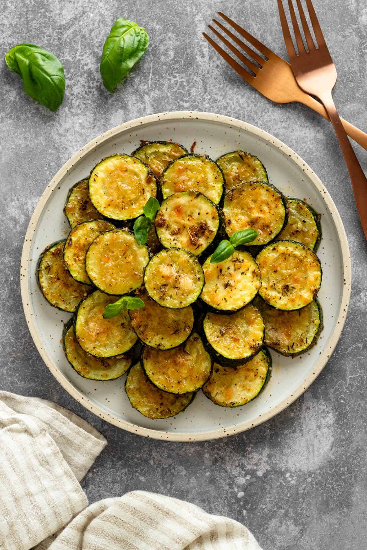 garnished with basil slices of zucchini in a serving bowl.