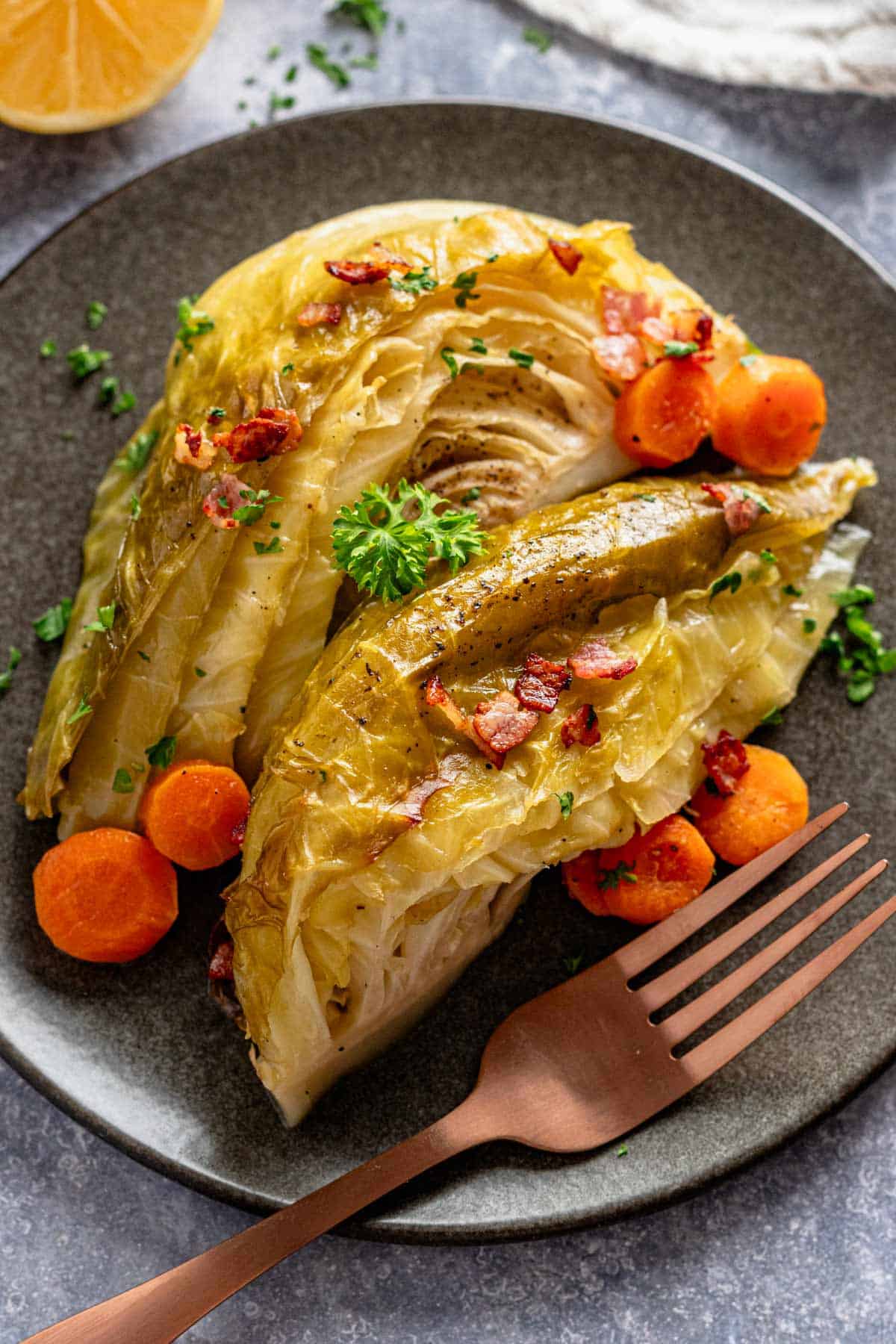 two cabbage wedges on serving plate.