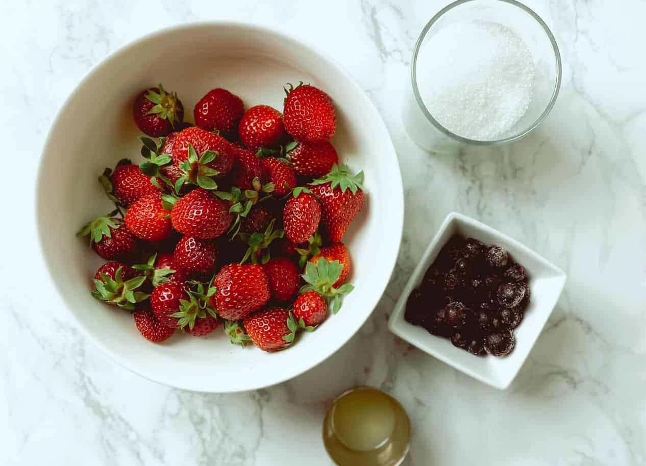 This homemade strawberry sauce is only 5 ingredients, and is the perfect berry topping to go on ice cream, cheesecake, pancakes, waffles, yogurt, biscuits and more!