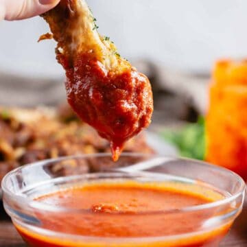 chicken leg dipped in buffalo sauce