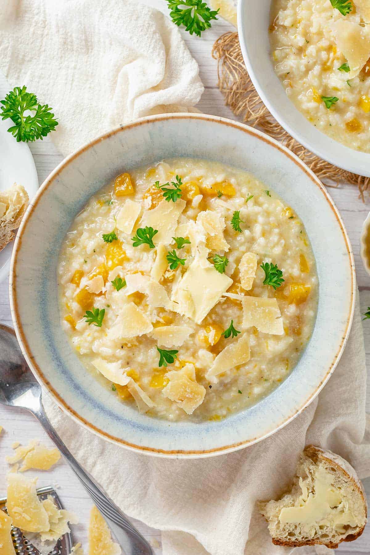 top shot of a pumpkin risotto in a light blue bowl