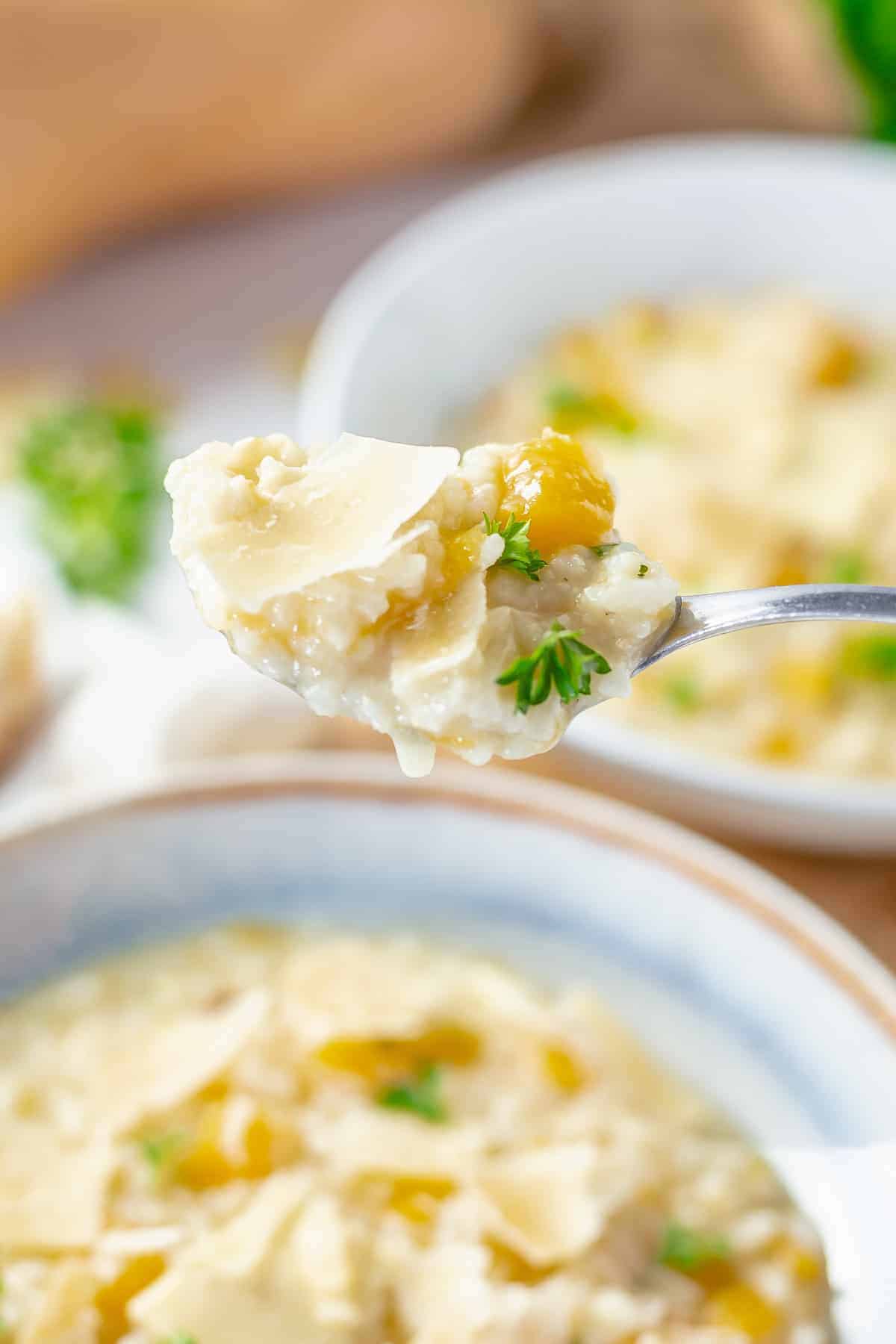 close up shot of risotto on a spoon