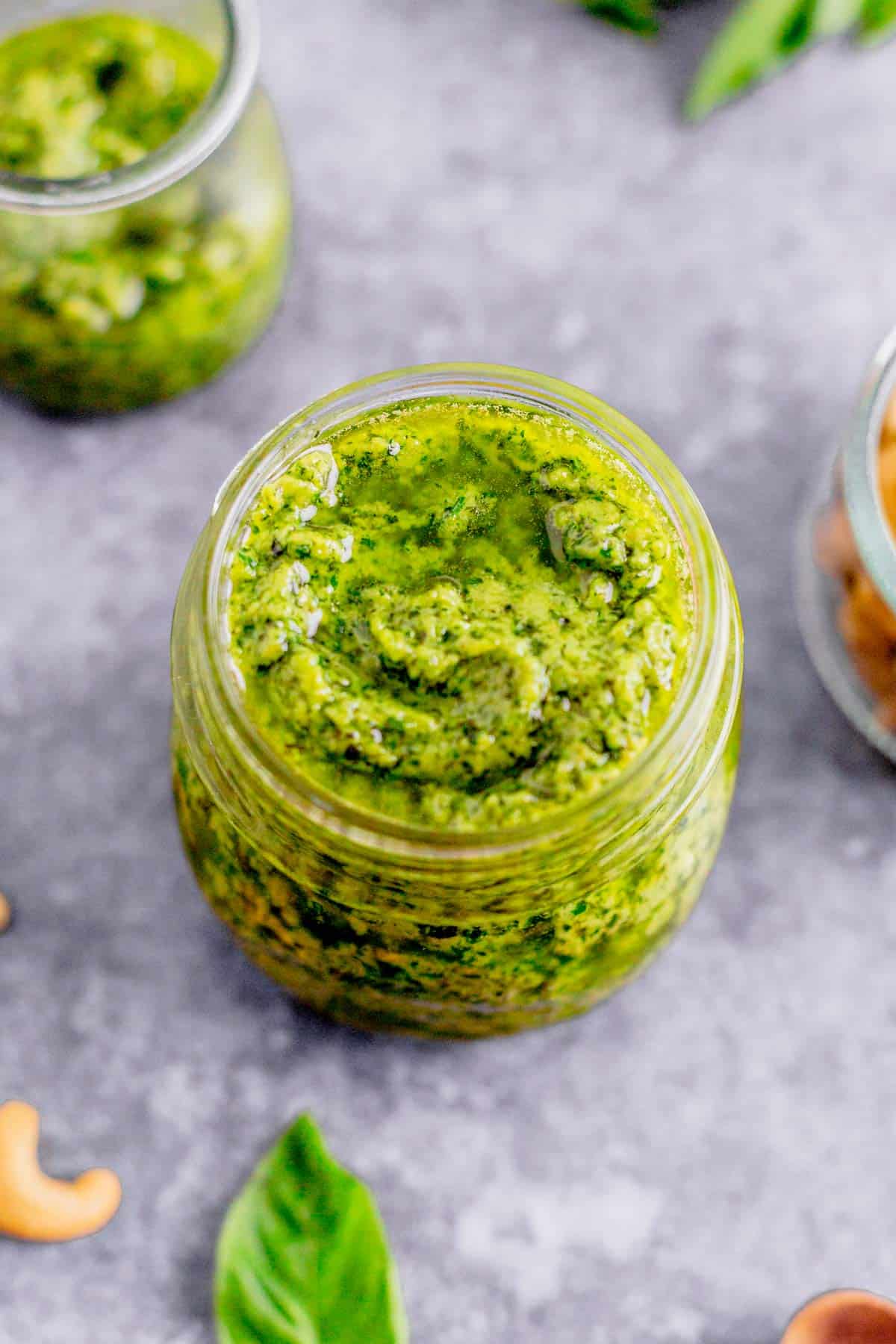 cashew basil pesto in a glass jar