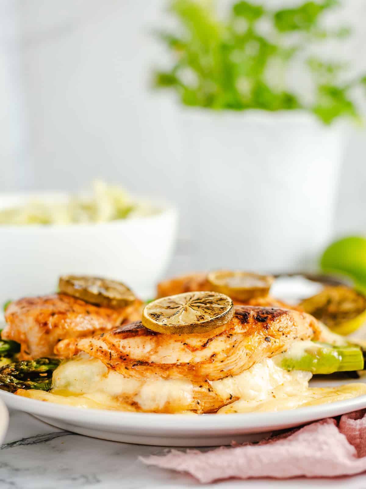 angle view of plated final image of asparagus stuffed chicken breasts