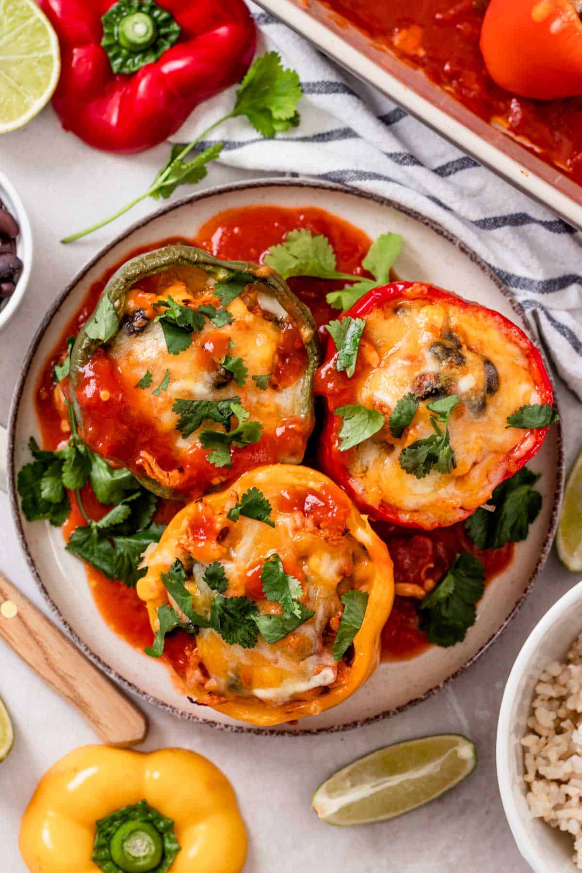 three stuffed bell peppers on a plate