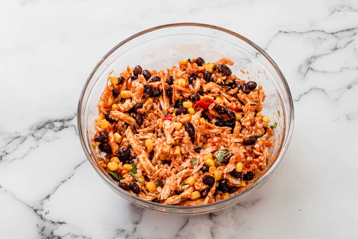 chicken enchilada stuffing mixture in a mixing bowl