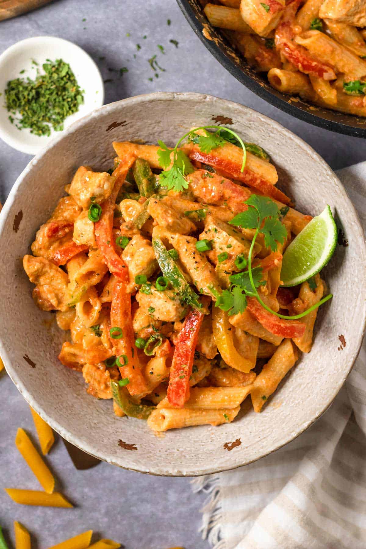 Chicken Fajita Pasta in a bowl with herbs