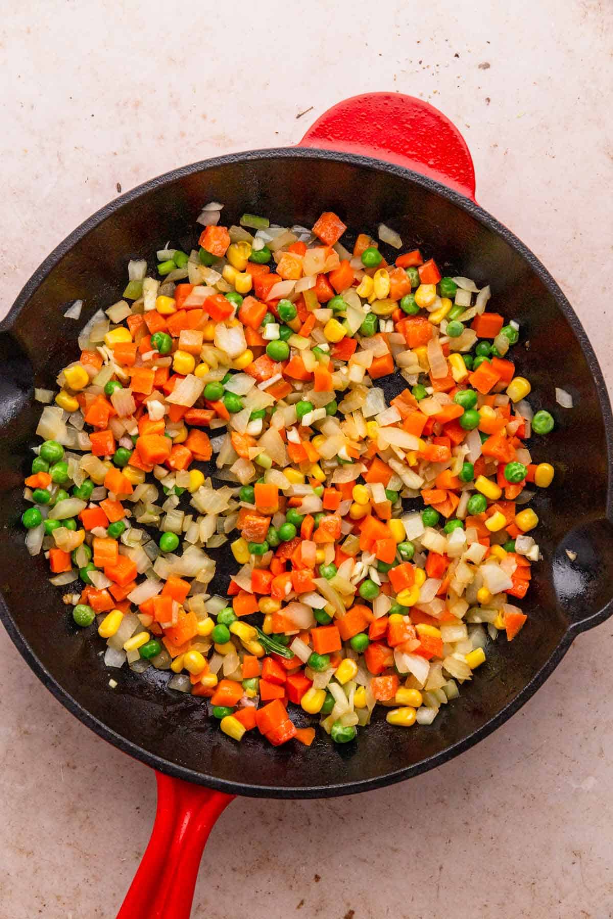 frozen veggies in skillet.