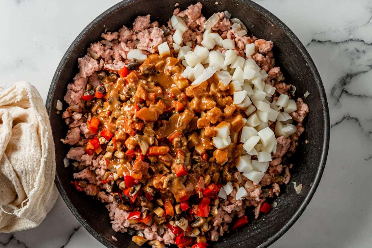 picture of filling for chicken lettuce wraps cooking in a pan