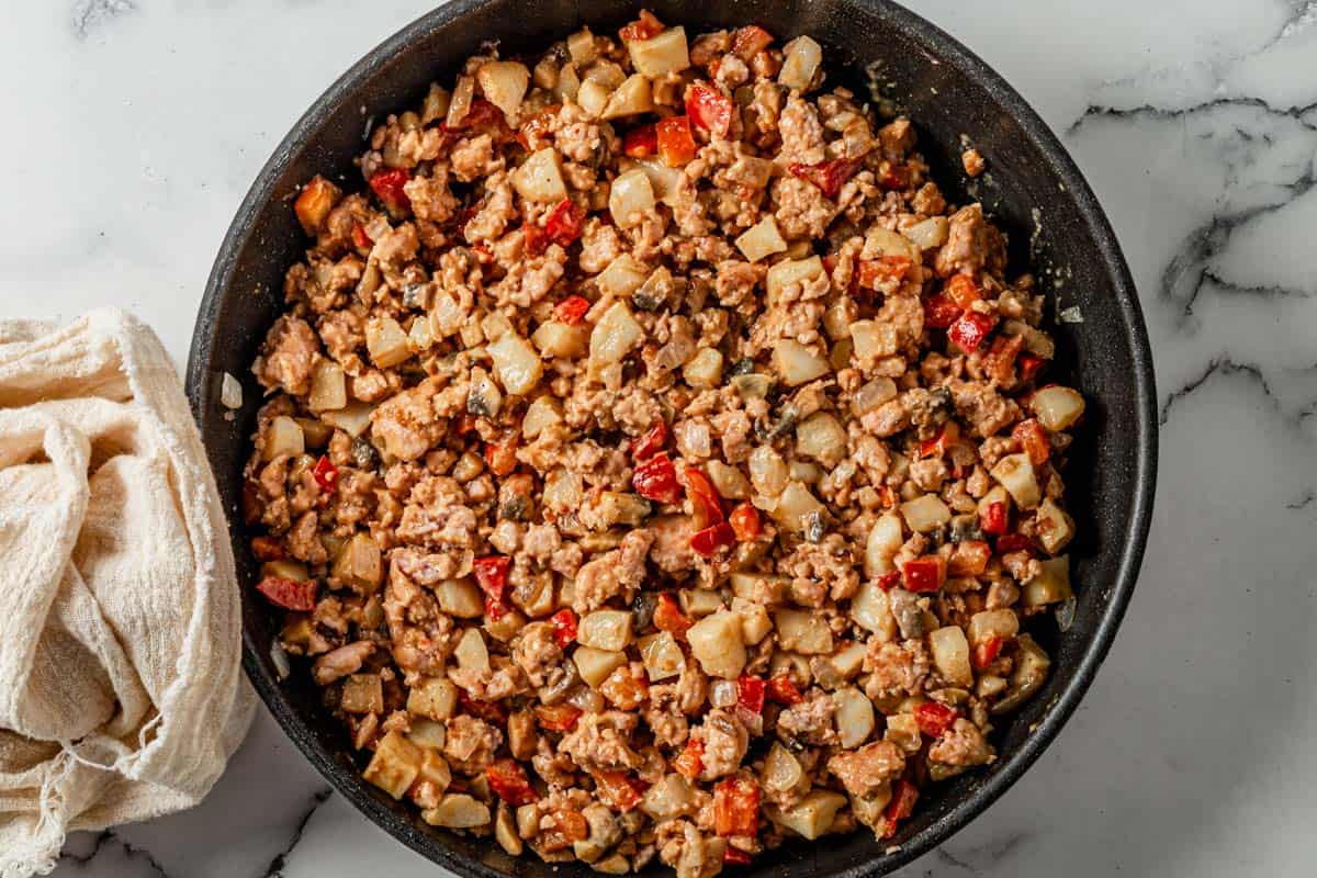 picture of filling for chicken lettuce wraps cooking in a pan