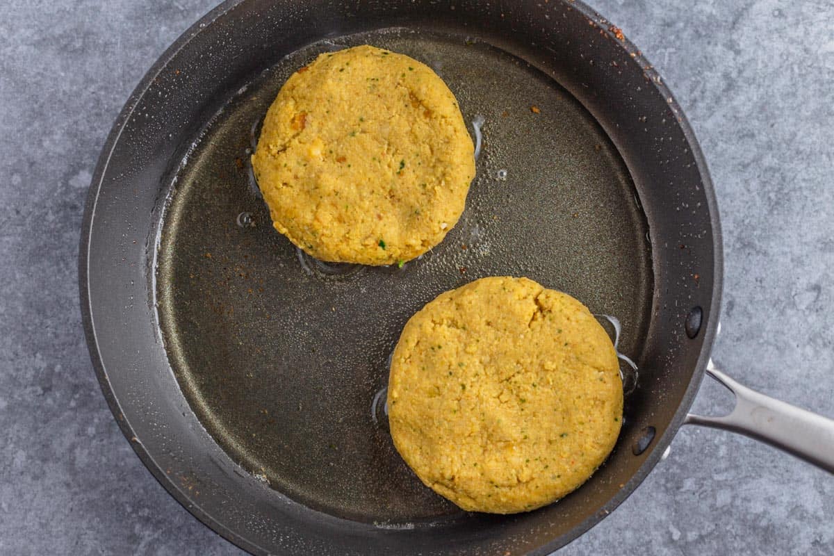 chickpea patties frying in a pan