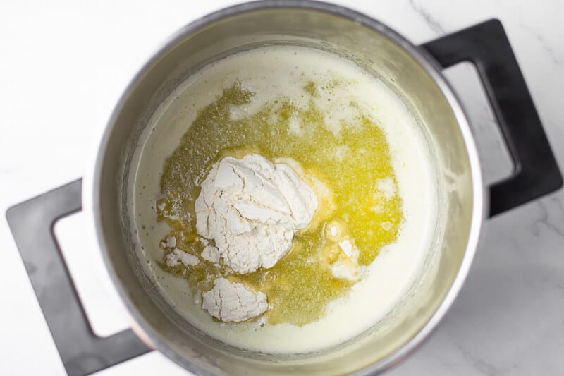 flour added to roux in a pot for cream of chicken soup