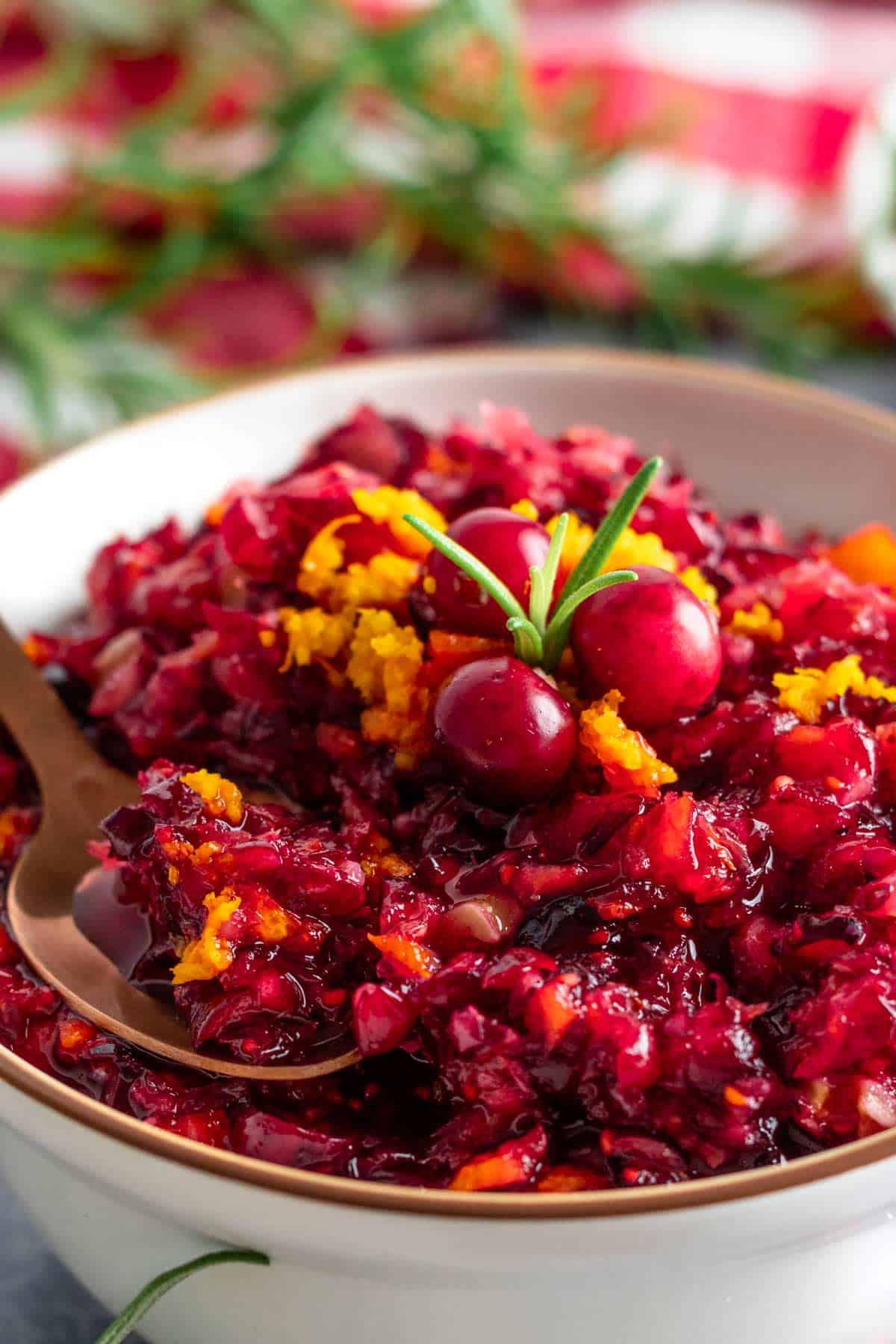 orange cranberry walnut relish in a bowl.