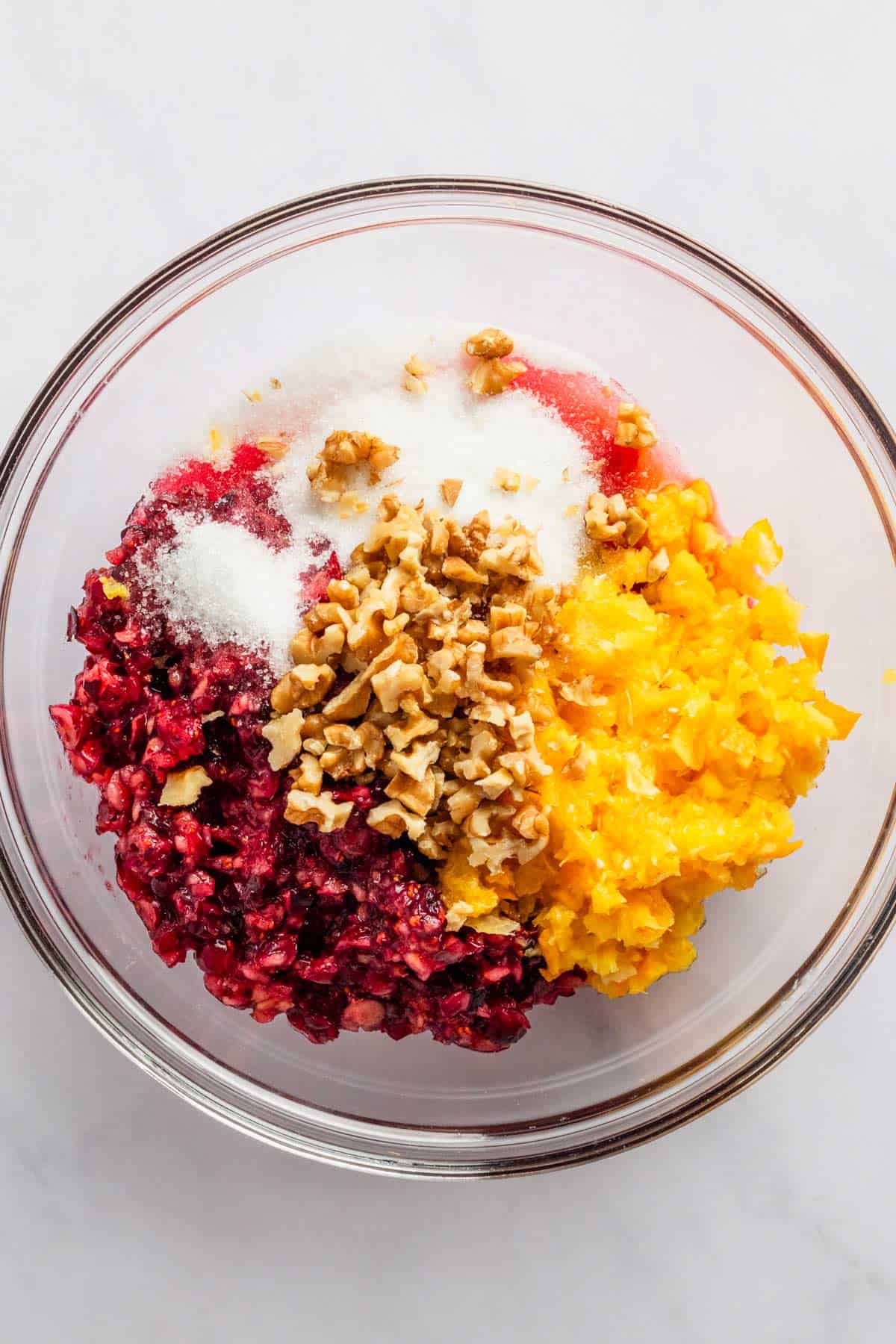 oranges, cranberries, sugar and nuts in food processor.