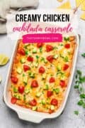 chicken enchilada casserole with tomatoes, avocado and cilantro