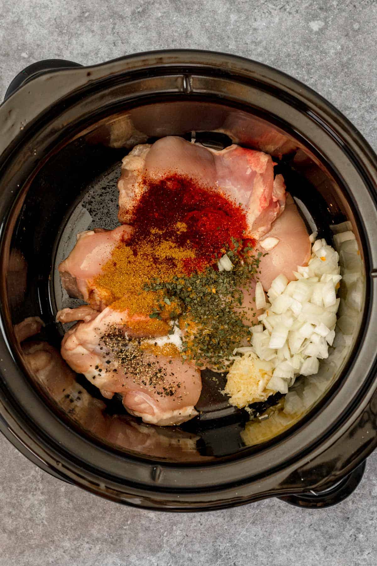 all the ingredients for chicken chili in slow cooker before cooking