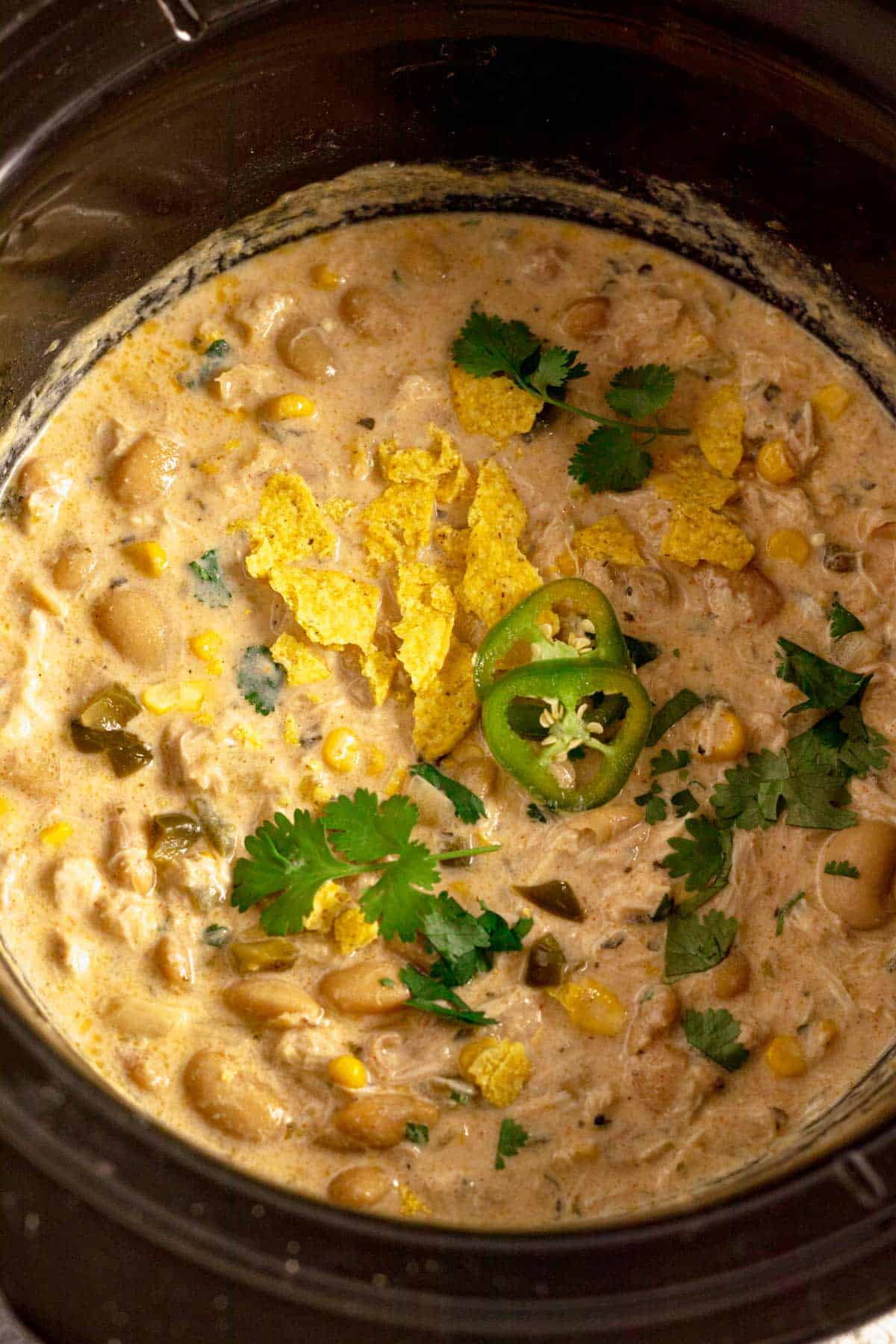 Crock Pot Chicken Chili Cream Cheese with doritos and cilantro