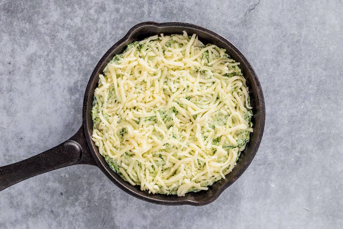 cheese added to unbaked spinach artichoke dip