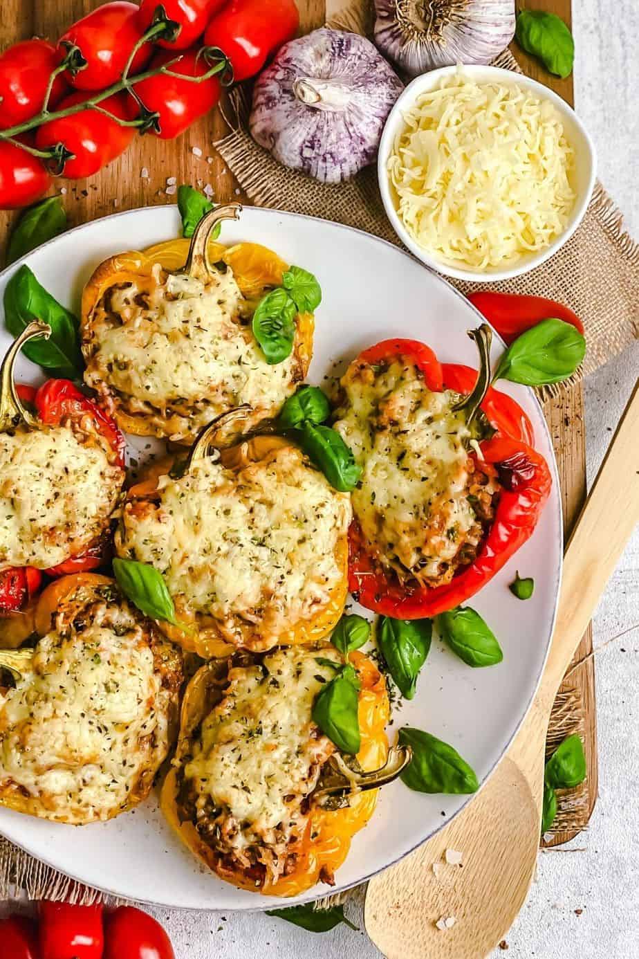 These stuffed bell peppers are easy to make, quick and filling. This recipe has the best of simple ingredients – fresh bell peppers, ground beef, onions, tomatoes, cheese and the right seasonings that come together in a beautiful tasty meal.