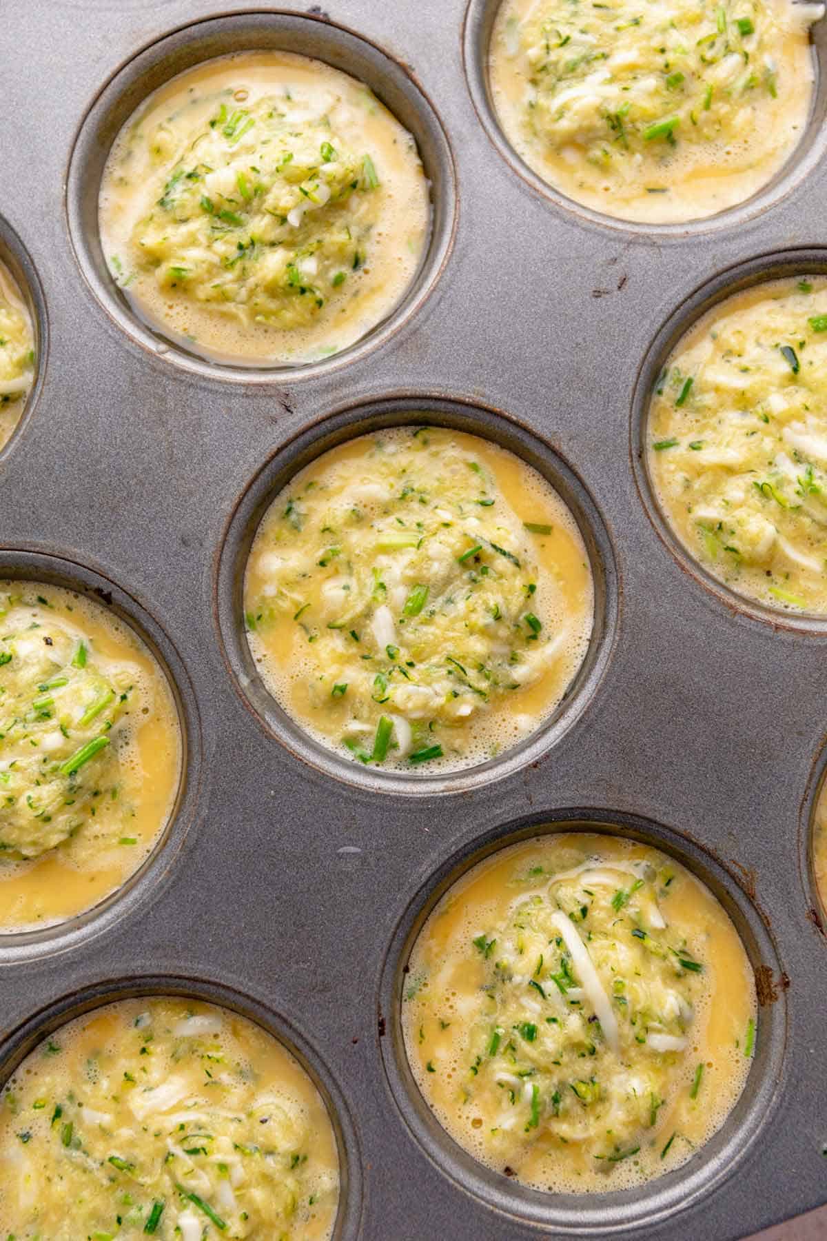 egg bites batter poured into muffin tins.