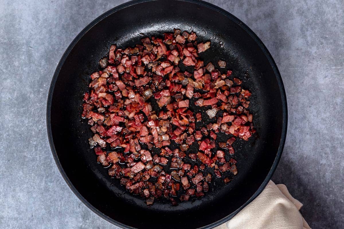 bacon cooking in the skillet