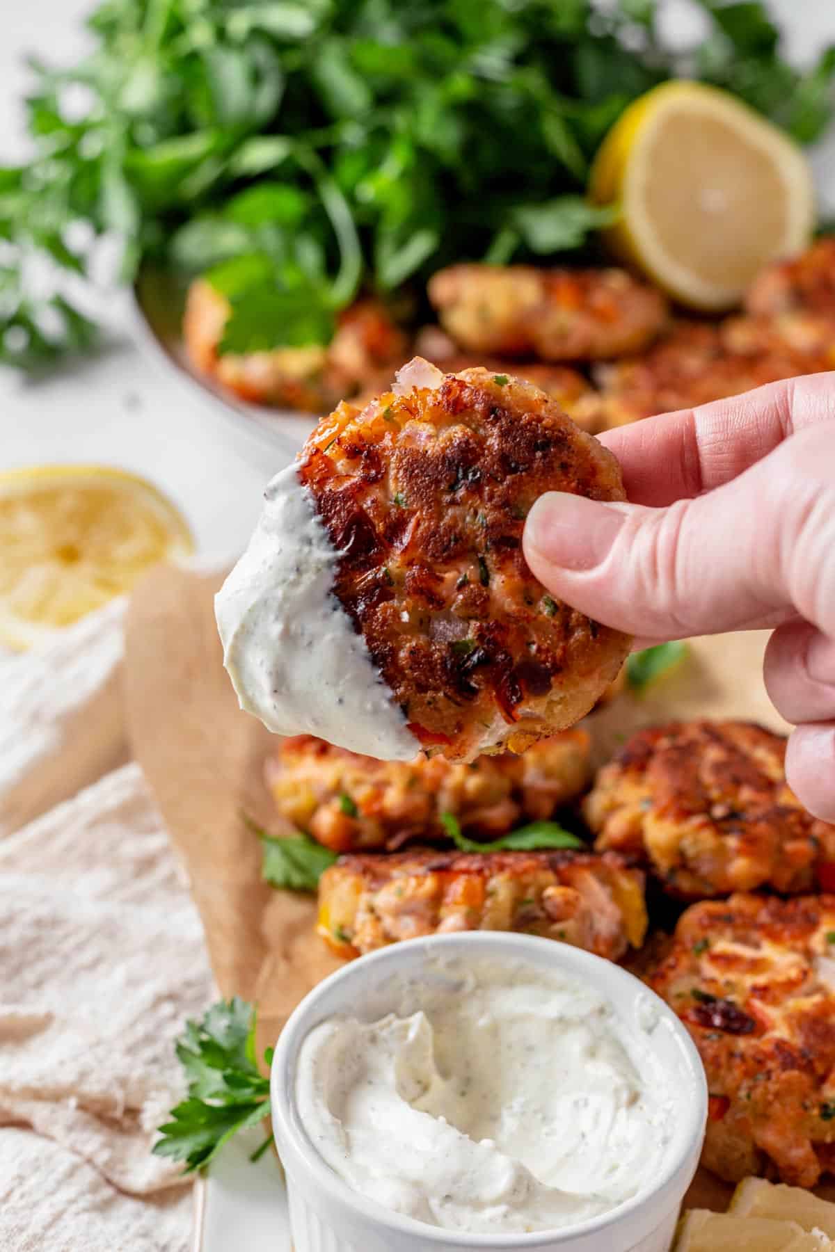 Fried Salmon Patties on a serving plate with parsley