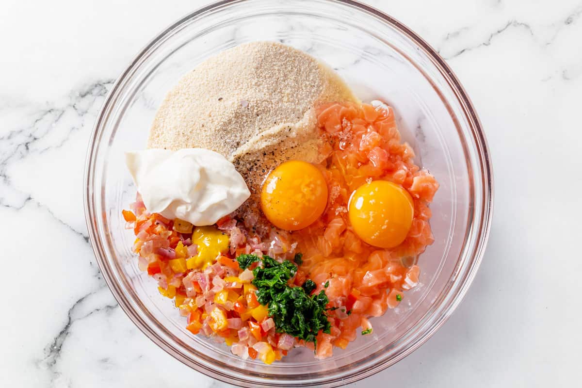 ingredients for salmon patties in a bowl before mixing together