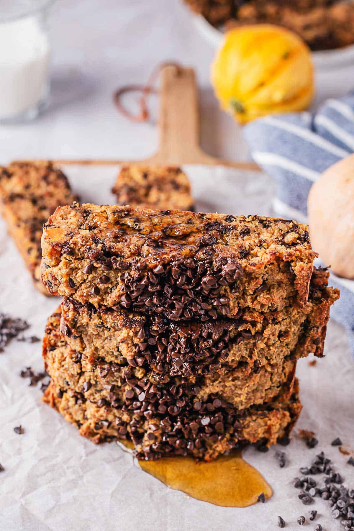 maple syrup drizzled over stack of gluten free chocolate chip bread