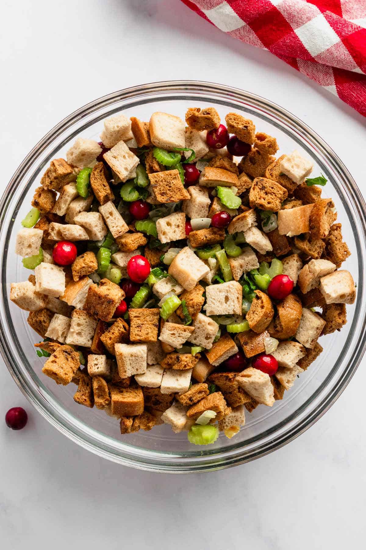 toasted bread, veggies and herbs in a bowl for stuffing.