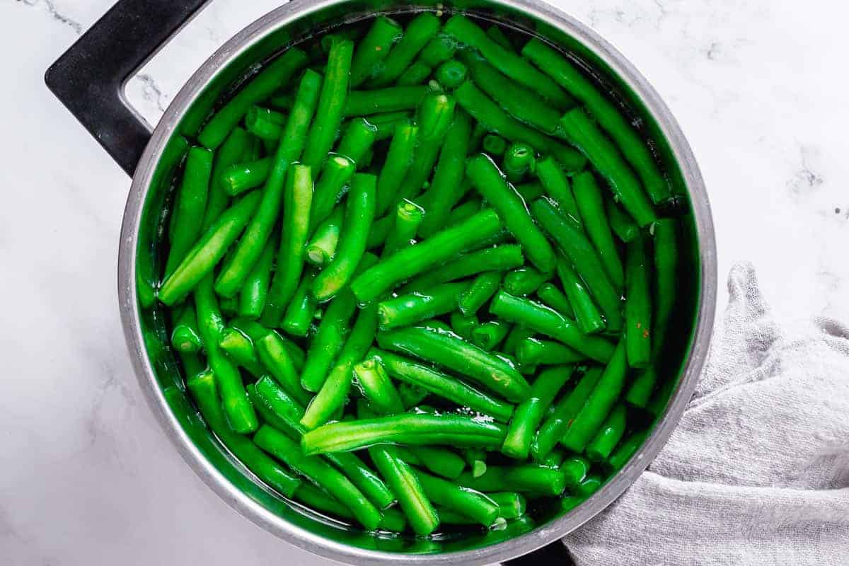 Trimmed Green beans in a pot with water