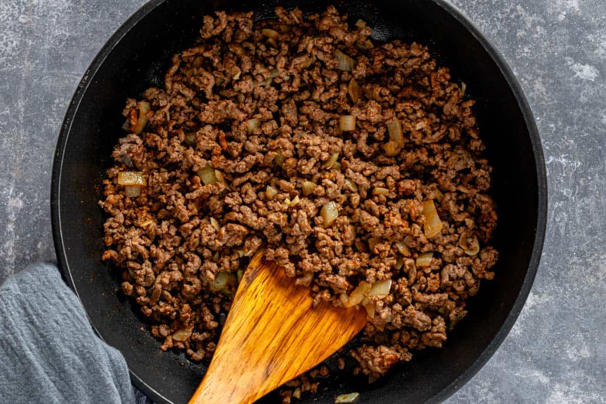 cooking ground beef in skillet.