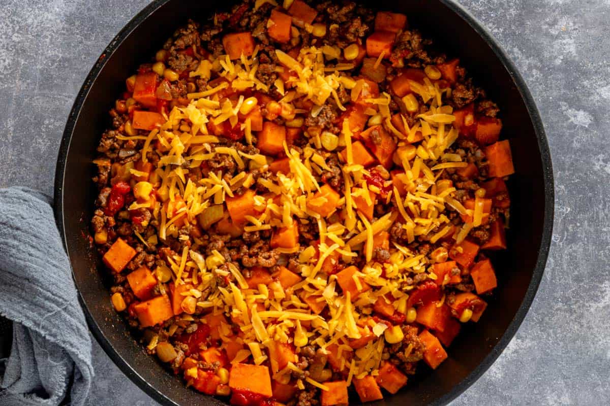 ground beef and potatoes topped with grated cheese.