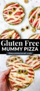 Halloween Mummy Pizzas - is the perfect Halloween party or dinner idea. Make these mummies with your kids for an easy and super flavorful Halloween themed meal. These mini pizzas are also gluten-free! The Yummy Bowl #savouryhalloweenfood #halloweenfoodrecipes #halloweenmummypizza #mummypizza #creepyhalloweenfoodideas #traditionalhalloweenfood #halloweentreats 