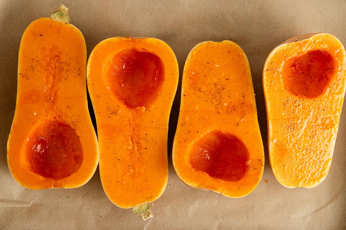 raw butternut squash halves before roasting.