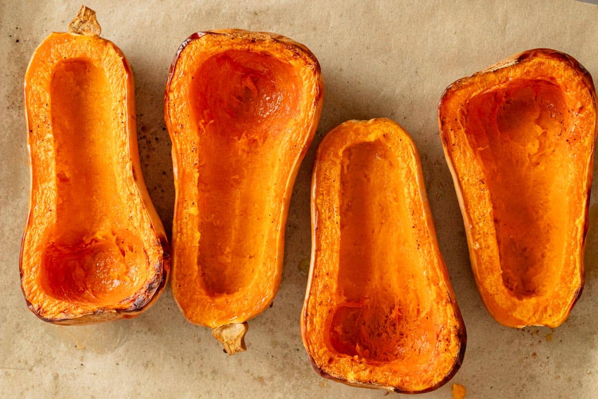 cooked butternut squash halves.