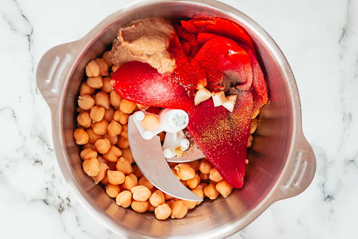 ingredients for roasted pepper hummus in a blender before blending