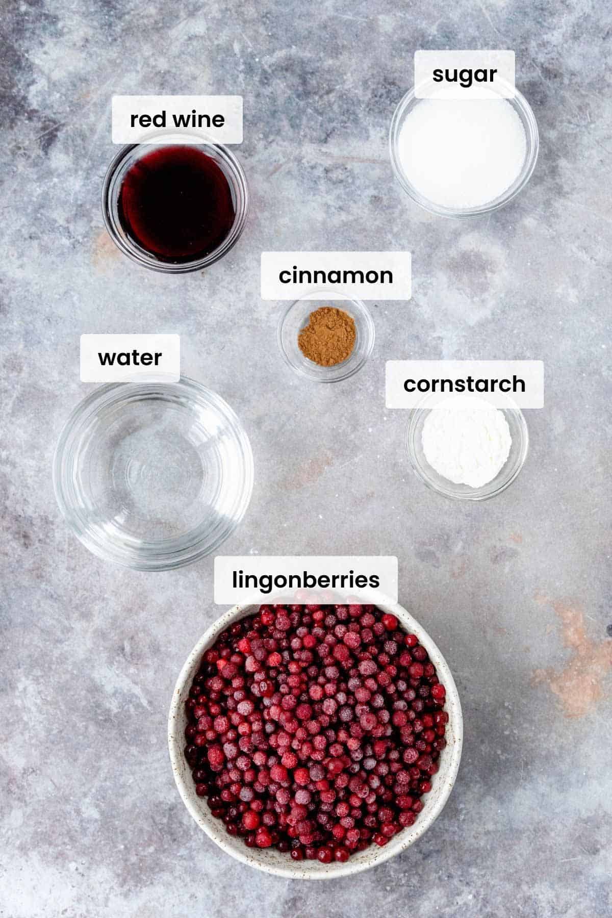 lingonberry sauce ingredients on a white marble background