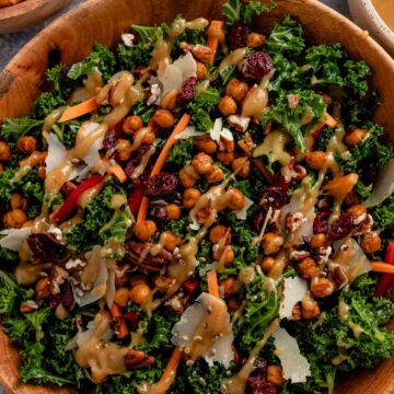 kale salad with lemon tahini dressing in a serving bowl