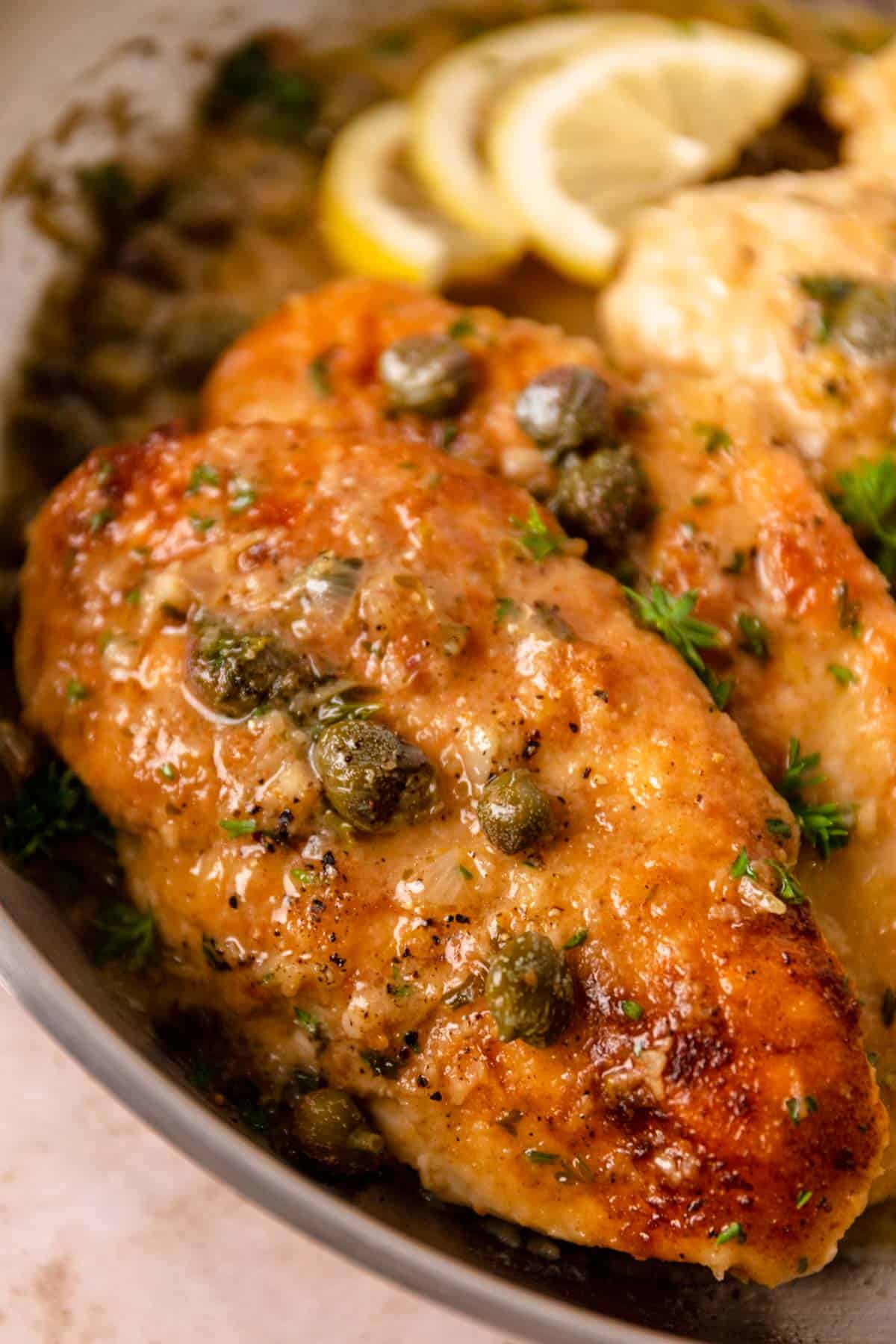 lemon caper chicken piccata in a skillet