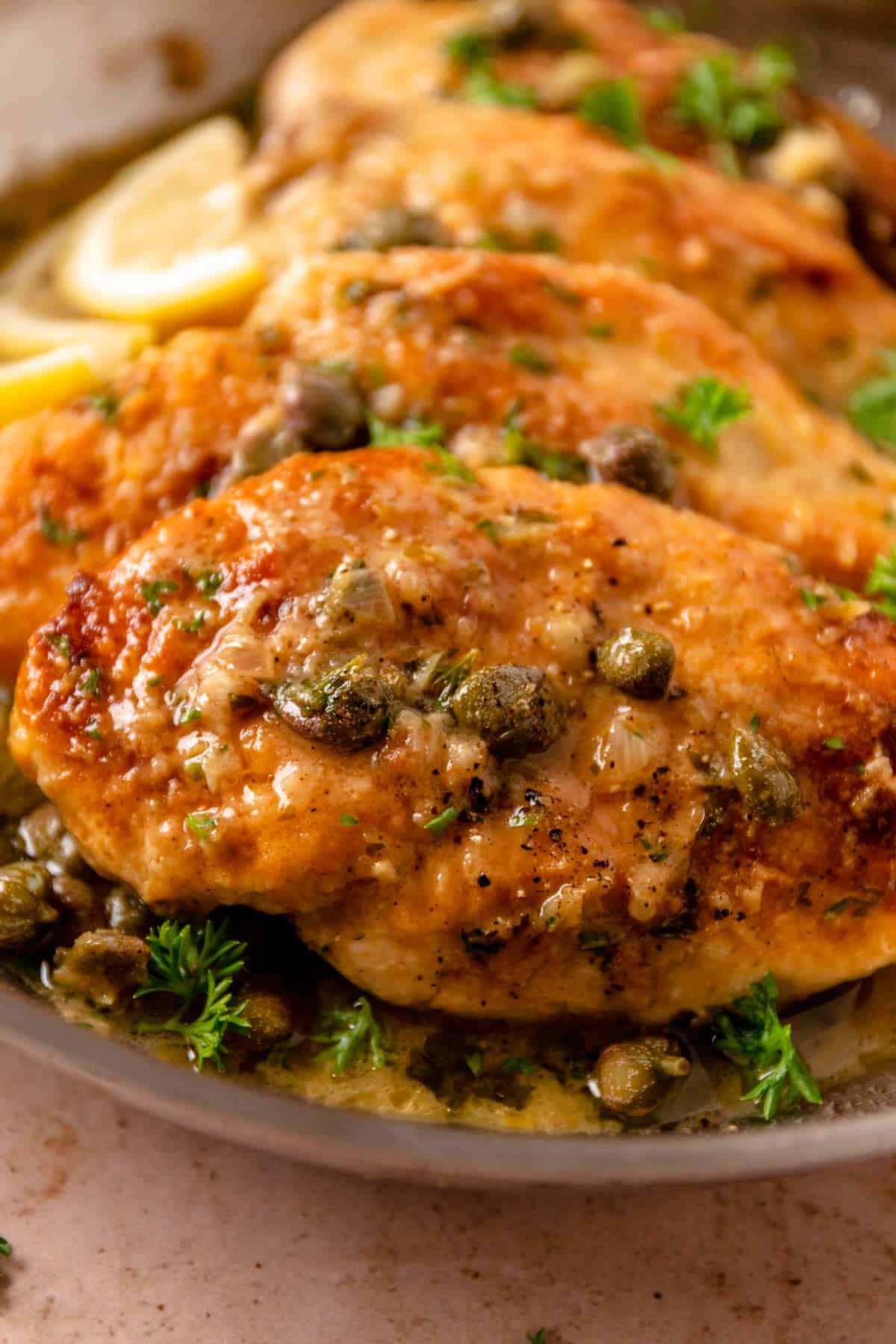 lemon caper chicken piccata in a skillet