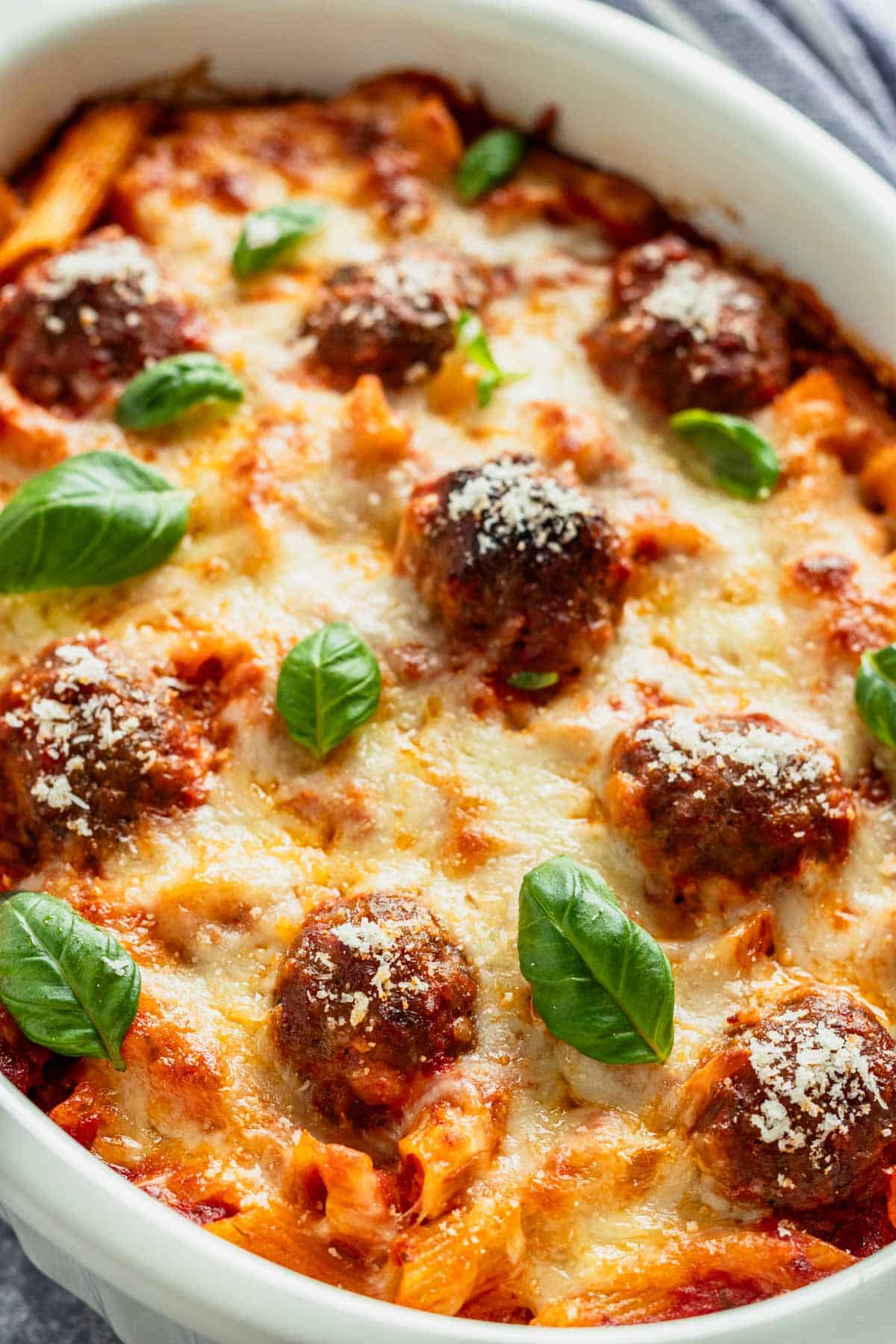 meatball bake in casserole with parmesan and pasta.