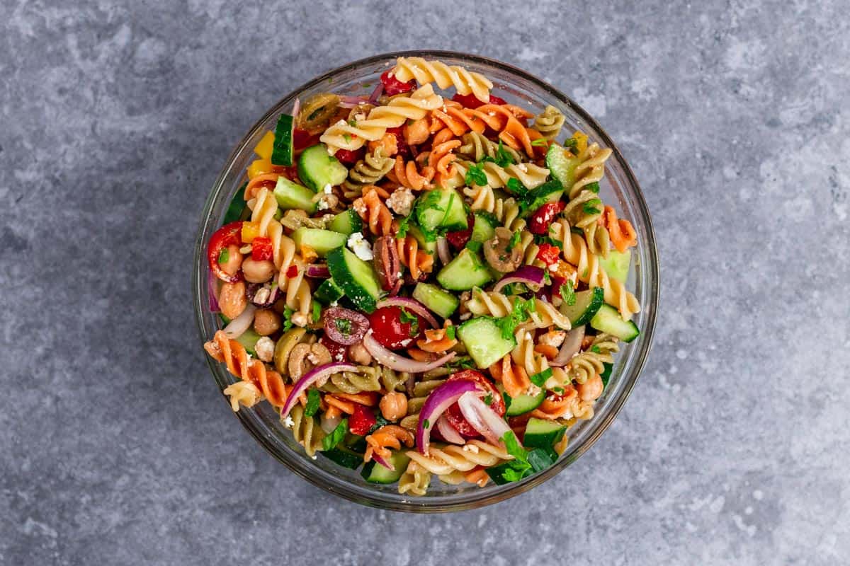 mediterranean pasta salad ingredients in a bowl