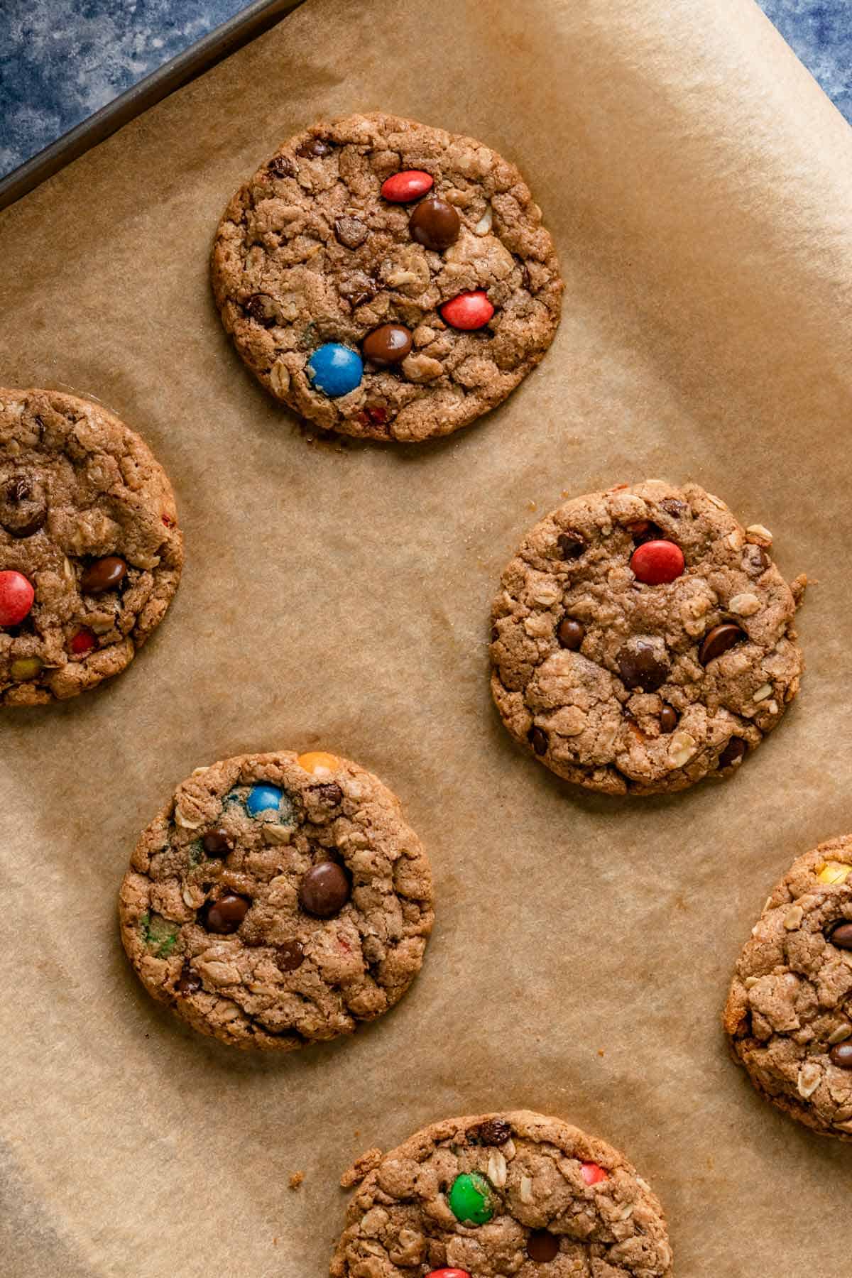 nutella monster cookies with m&ms on a baking sheet right after baking