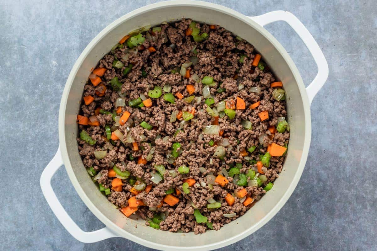 vegetables and beef cooking in the pot