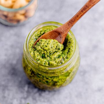 cashew basil pesto in a glass jar